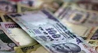Rupee continues slide against dollar; down 29 paise