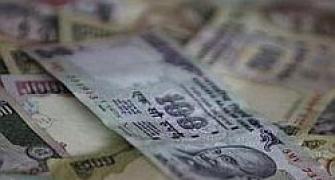 Rupee at two-week low, slumps 35 paise