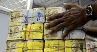 Rupee trims initial gains vs dollar; still up by 3 paise