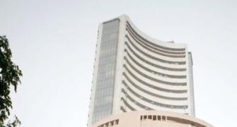 Sensex closes at record high of 21,034