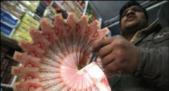 Rupee at 1-month high, up 7 paise at 59.04