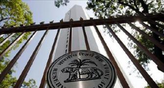 Weak rupee, high inflation force RBI to hold rates