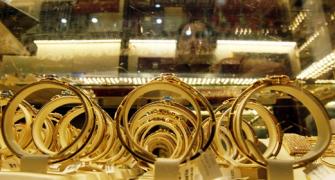 Gold falls on global cues; silver ends steady