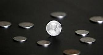 Rupee snaps 2-day losing string, up a paisa to 54.36