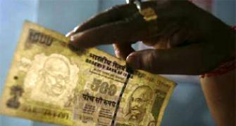 Rupee pares initial gains, still up 7 paise vs USD