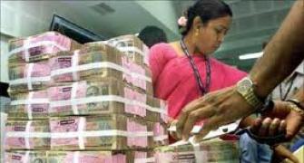 Rupee up 12 paise against dollar in early trade