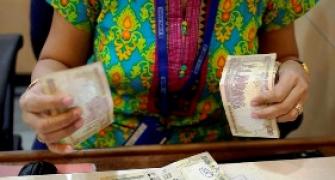 Rupee gains as Sensex hit record closing high