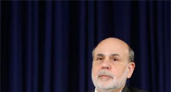In Bernanke's final act, Fed cuts stimulus despite market turmoil