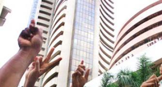 Market ends at record highs; Sensex tops 25,000
