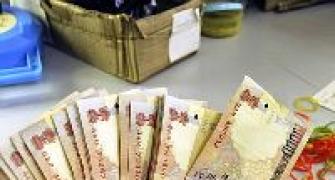Rupee hits 8-month high; RBI seen buying dollars