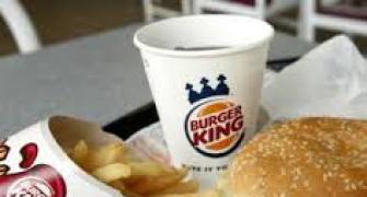 Late to the party, Burger King reins in prices