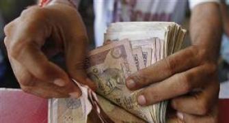 Rupee down 10 paise against dollar in late morning trade