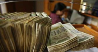 Rupee at 1-week low against dollar; falls 20 paise to 62.51