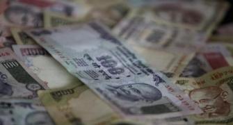 Rupee rebounds from one-week low, up 9 paise against dollar
