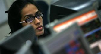 Markets at day's low; PSU banks shine