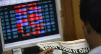 Markets end flat ahead of F&O expiry; Tata Motors top loser