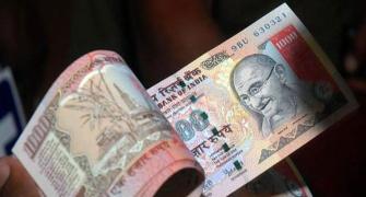 Rupee weakens further to 67.48, ends down 17 paise