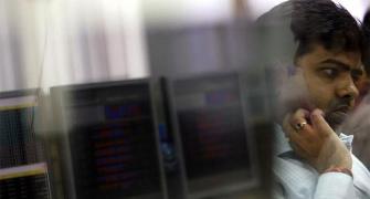 Sensex ends down 220 points in volatile trade