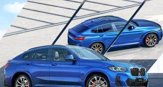 BMW X4 lords over other cars on the road