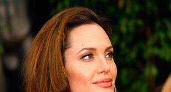 Angelina Jolie to adopt child from Haiti?