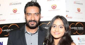 Ajay Devgn walks red carpet with daughter