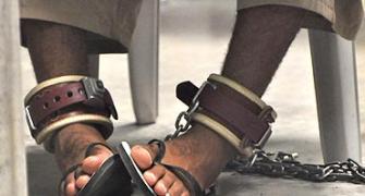 Guantanamo: Justice paused, shackled