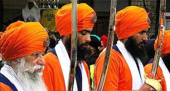 Pix: Sikhs wield swords to protect gurdwara in UK 