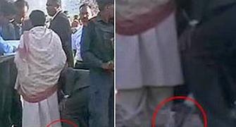 PSO cleans Mayawati's shoes, opposition slams CM