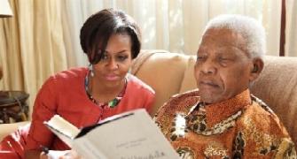 IMAGES: Michelle Obama's candid moments with the Mandelas