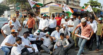PIX: NCP workers take to the streets to protest attack on Pawar