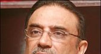 Pak court seeks Zardari's response on double role