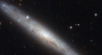 NASA captures pictures of dusty spiral galaxy