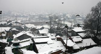 IN PICS: Heavy snowfall shuts down Kashmir