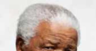 Mandela's health improves, breathes 'without difficulty'