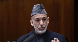 Karzai arrives in India; to seek military aid