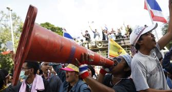Thai protesters ignore PM's plea, cut power to police HQ