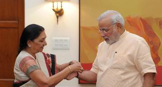 PHOTO: Anandiben Patel ties rakhi to Modi
