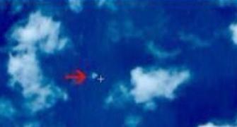 China locates suspected crash site of missing plane