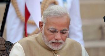 Modi restructures Cabinet to club 17 ministries under 7 ministers