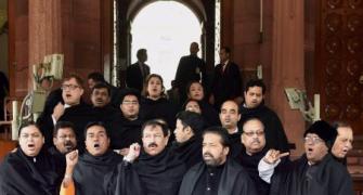 After black umbrellas, TMC brings black shawls to Parliament