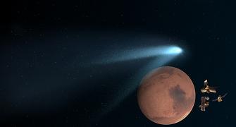 PHOTOS: Mountain-sized comet whizzes Mars after a million years