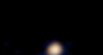 NASA probe clicks FIRST-EVER first colour image of Pluto