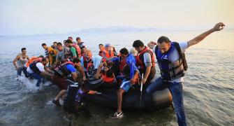 PIX: Fleeing war and repression, refugees flood Greece island