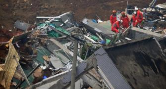 Two persons found alive over 60 hrs after China landslide