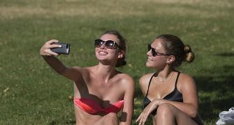 Europeans sweat and soak in sizzling summer