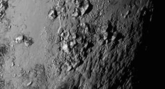 FIRST PHOTOS: A whole new world on Pluto