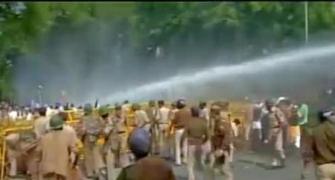 Congress workers protesting land bill face water canons, lathis