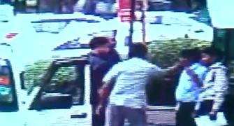 Caught on CCTV: Culture minister's security thrashes society guards
