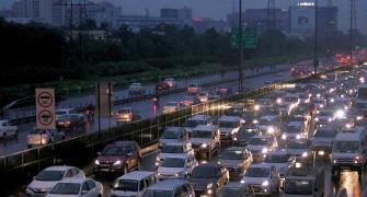 PHOTOS: Water-logged Delhi battles with slow traffic