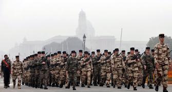 Why are French troops marching down Rajpath?
